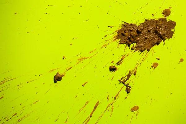 Splash van clay op geel — Stockfoto