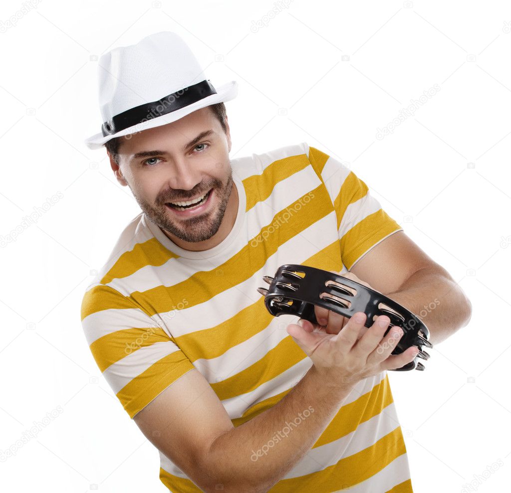 Happy man in colorful shirt with tambourine