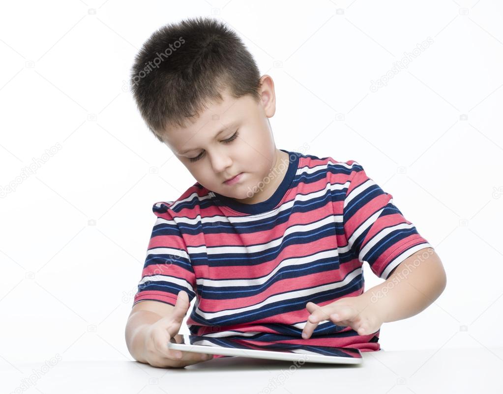 Boy playing on tablet Pc