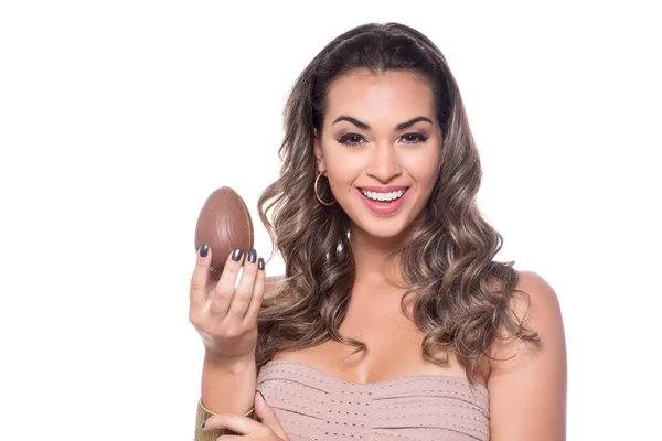 Woman holding a chocolate egg — Stock Photo, Image