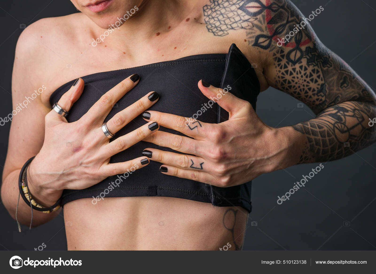 Transgender non-binary tomboy wearing Binder bra for aesthetic. Small  breast Self identity problem Stock Photo by ©Sangiao_photography 510123138