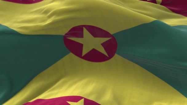 4k Grenada National flag wrinkles loop seamless wind in blue sky background. — Stock Video
