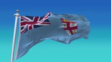 4k Fiji Ulusal bayrak kırışıklıkları mavi gökyüzü arka planında pürüzsüz rüzgar döngüsü.