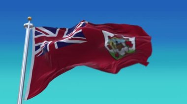 4k Bermuda Ulusal bayrak kırışıklıkları mavi gökyüzü arka planında pürüzsüz rüzgar döngüsü.