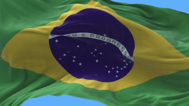 4k Brasilien Nationalflagge Falten Schleife nahtloser Wind in blauem Himmel Hintergrund. — Stockvideo