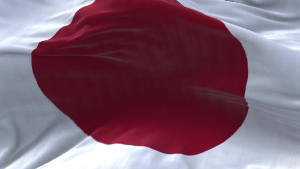 4k Japan National flagga rynkor loop sömlös vind i blå himmel bakgrund. — Stockvideo