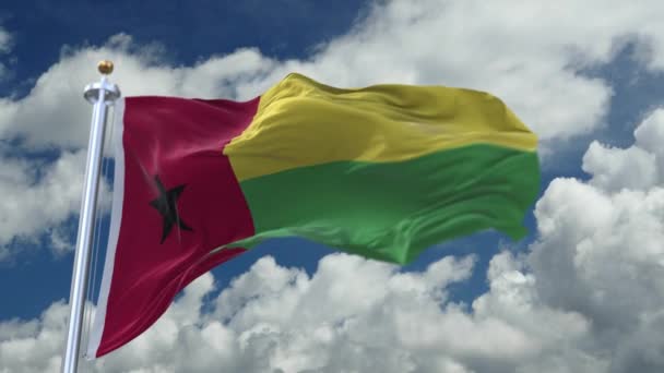 4k looping flag of Guinea Bissau waving in wind,timelapse rolling clouds backgr — ストック動画