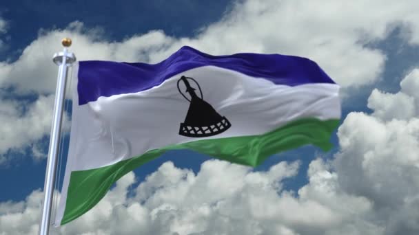 4k looping zászló Lesotho integetett a szélben, timelapse gördülő felhők háttér. — Stock videók