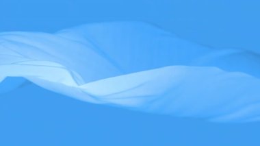 4k Mavi dalgalı ipek kumaş rüzgarda, dikişsiz dalgalanan bayrak bez döngü arka plan.