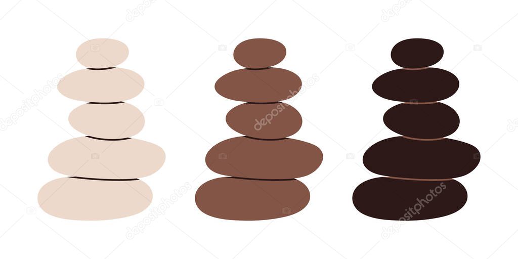 Set of stacked Zen stones cairns in earthy colors. Great for spa, meditation, and wellness design.