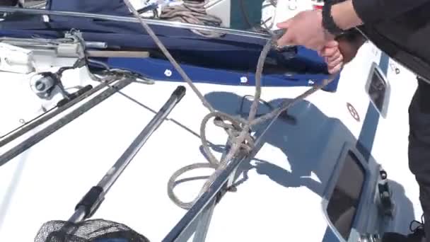 Male Hands Yachtsman Untie Rope Order Raise Sail Yacht — Stock Video