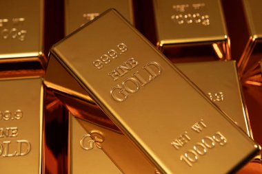 Yatırımda altın külçesi. Altın sarısı arka plan. Altın rezervi külçeleri. Altın ve bankacılık kavramları