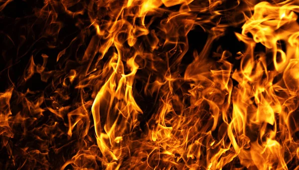 Ateşli arka planı ateşle. Alev alev yanan alevler. Ateş yoğun yanan enerji. Ateş dramatik ısı dokusu