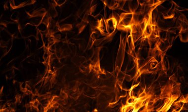 Alevli arka planı ateşleyin. Yanan ateş hareketi. Ateşin yoğun ısı enerjisi. Parlayan soyut ışık