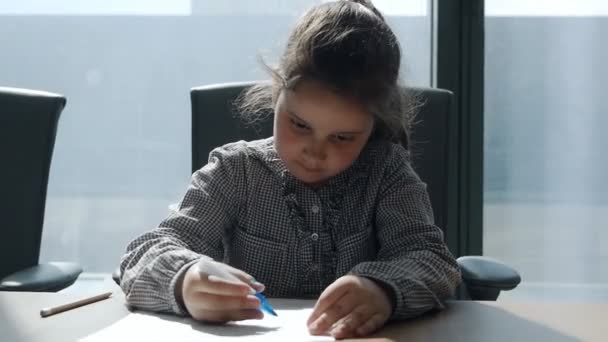 Cute child working in modern office with documents — Stock Video