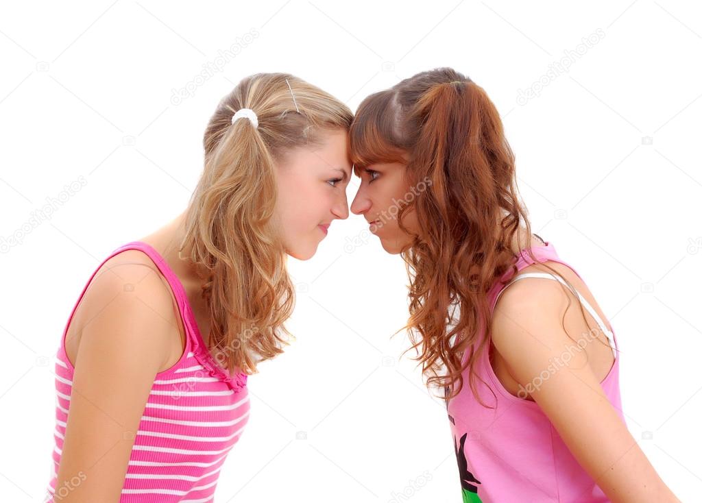 two teenage sisters staring at each other