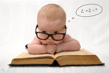 Baby in glasses counting in mind