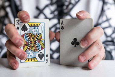 Calgary, Alberta, Canada - July 10, 2020: Person shuffling and playing cards