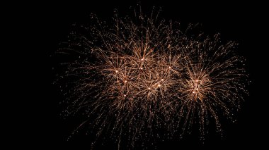 Glowing fireworks in the night sky background