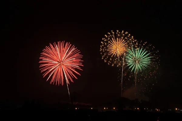 Colorful fireworks over dark sky — Stock Photo, Image