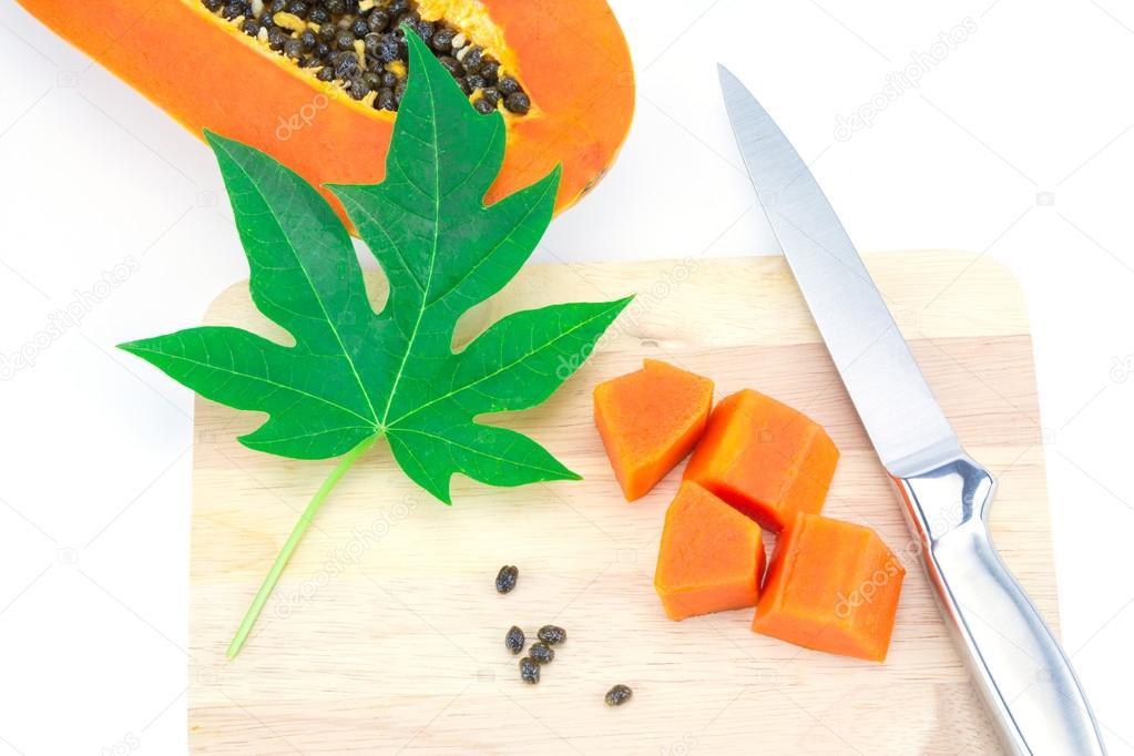 Sweet papaya slice on chopping bord isolated on white background