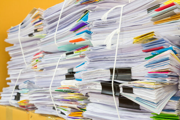 Stack of business papers isolated on white background