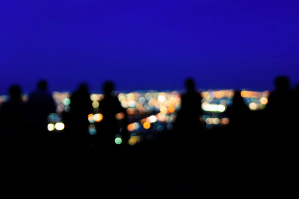 Blurred tourists and city lights — Stock Photo, Image