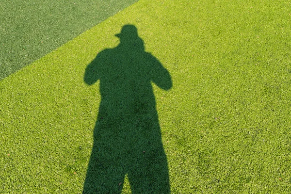 Shadow on the green soccer field — Stock Photo, Image