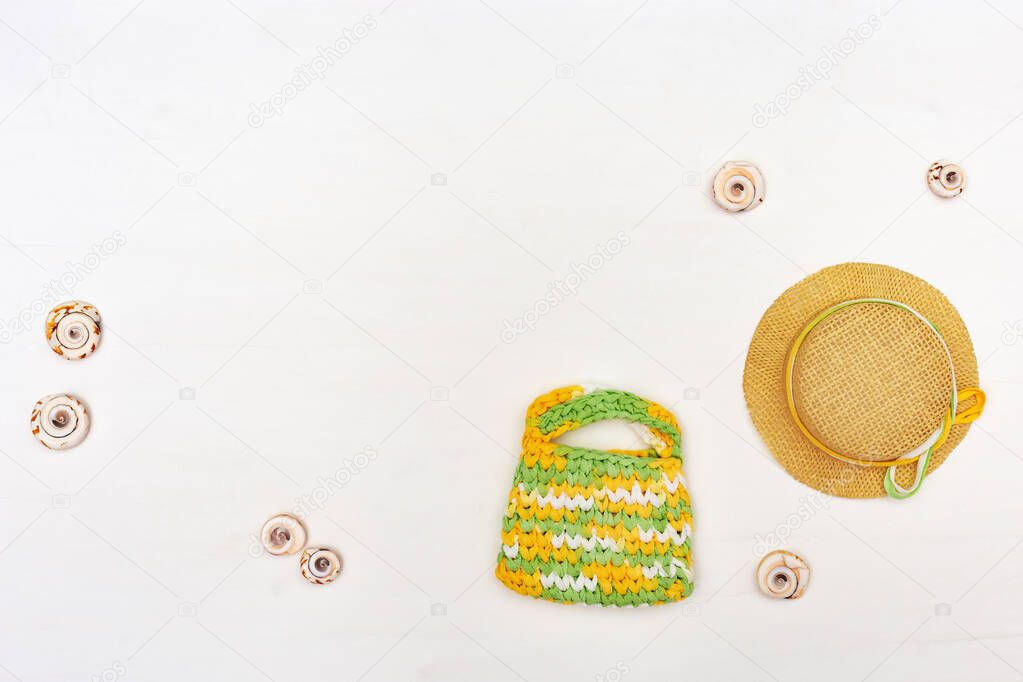 Summer items - sun hat, bag, towel on white background. Summer concepts.
