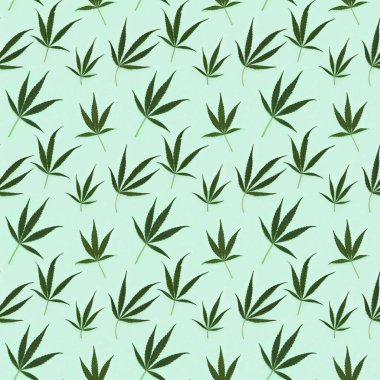 Kusursuz desenli kenevir açık yeşil kağıtta bırakır. Kumaş üzerine baskı, ambalaj kağıdı.