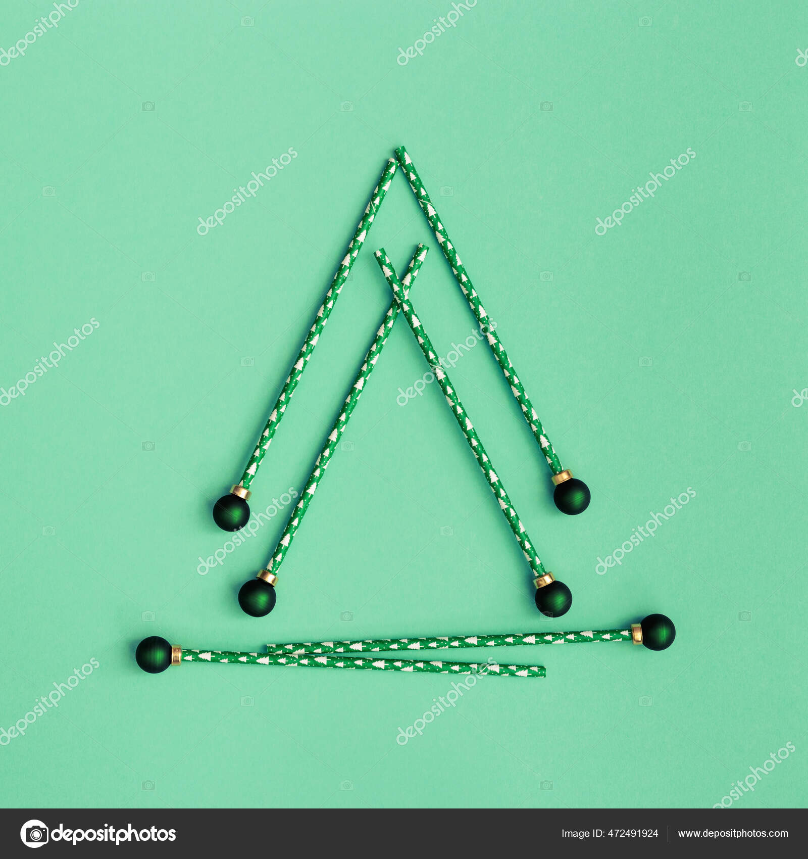 Christmas tree made of drinking straws on green background with tinsel  Stock Photo - Alamy