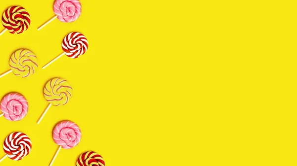 黄色の紙の背景にスティック上のストライプと甘い丸いキャンディーのループを持つ創造的なフレーム コピースペース付きカラーキャンディの背景 — ストック写真