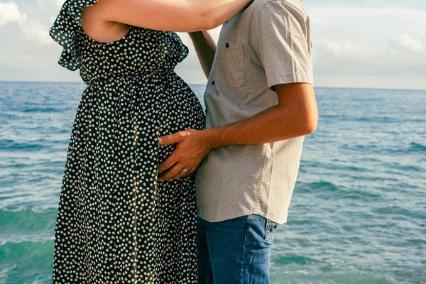 Pregnant Woman Hugging Her Partner Sea Interracial Couple Pregnant Expecting — Stock Photo, Image