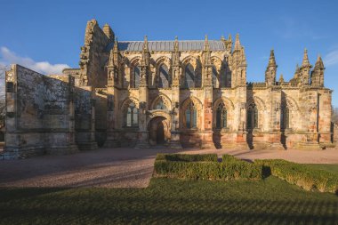 The historic Rosslyn Chapel in the Midlothian village of Roslin outside of Edinburgh, Scotland featured in the Da Vinci Code. clipart