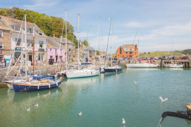 Padstow, UK - June 18 2021: A sunny summer day at Padstow Harbour in the seaside Cornish port town in Cornwall, England, UK. clipart