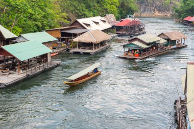 Floating house rafting at the river Kwai, Thailand clipart