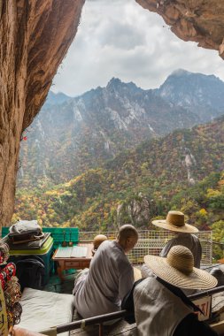 Buddhist monks at seorak mountains cave  clipart