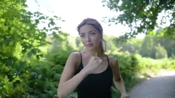 Pretty Young Woman Concentrates She Runs Park Path Pond Close — Stock Video