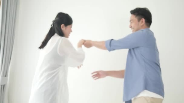 Happy Asian Couple Dancing Together Home Slow Motion — Stock Video