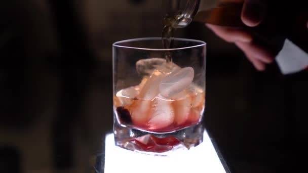 Whiskey Being Poured Slowmotion Base Old Fashioned Drink — Stock Video