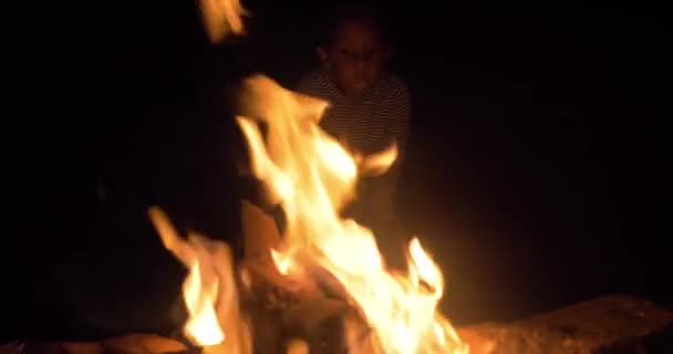 Young Mixed Raced Child Face Lit Light Camp Fire Night — Stock Video