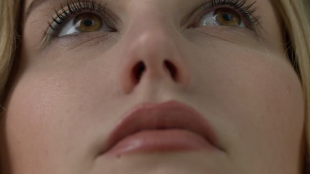 Ultra close up of young girls face and brown eyes
