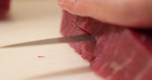 Person Cutting Tuna Fillet Half Using Knife Chopping Board Záběr — Stock video