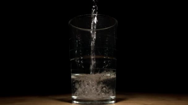 Video Shows Drinking Glass Filling Water Front Truly Black Background — Stock Video