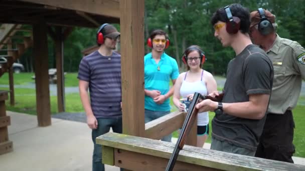 Steadicam Young Man Putting Shot Gun Cartridge Chamber Preparing Shoot — Stock Video