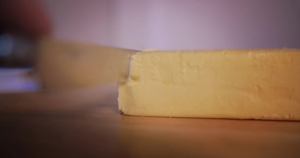 Man Slicing Butter Brick Knife — Stock Video