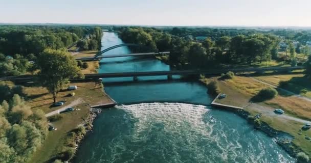 Huge Wave Big River Surfers Train Crossing Bridge Background — Stock Video