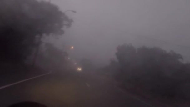 Riding Motorcycle Road Foggy Weather Water Pattern Lens Oncoming Headlights — Stock Video