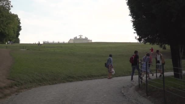 People walking up path to Gloriette at Schnbrunn Castle in Vienna.