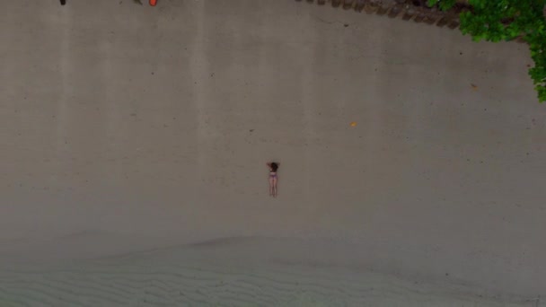 Marvelous Reversal Overhead Shot Woman Bikini Laying Sandy Beach — Stock Video